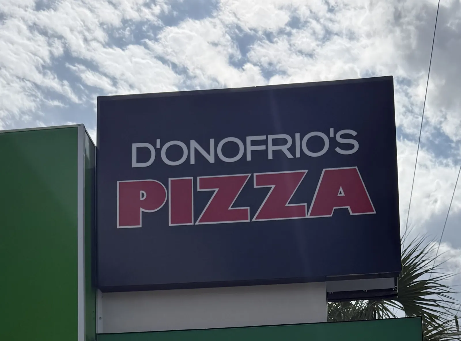 D'Onofrio's Pizza tenant panel on a roadside pylon sign