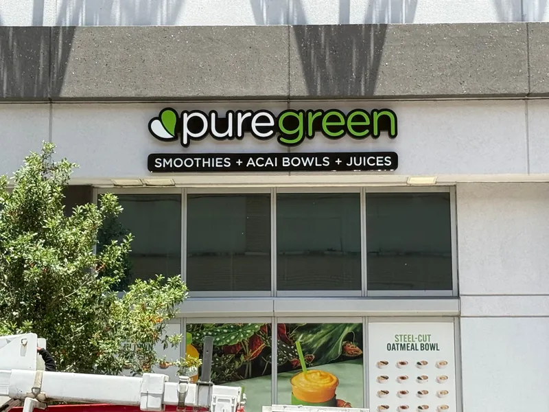 Pure Green smoothies channel letters on a mixed-use facade